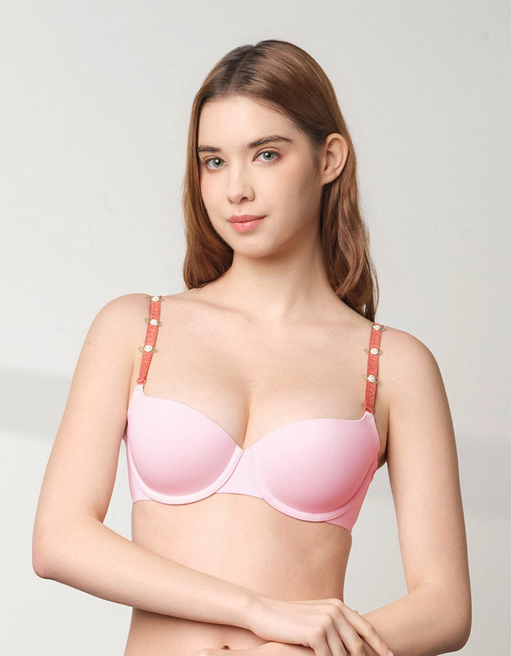 A beautiful model is wearing a pink SIGNATURE-ALPHA Balconet Lightly Lined Bra which is from Her own words 