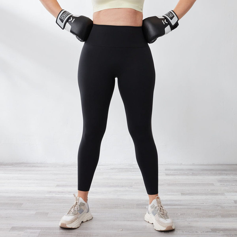 A girl is wearing a black HOW- EFFORTLESS High Waist Mesh Panel Full Length Sports Leggings from Her own words SPORTS 